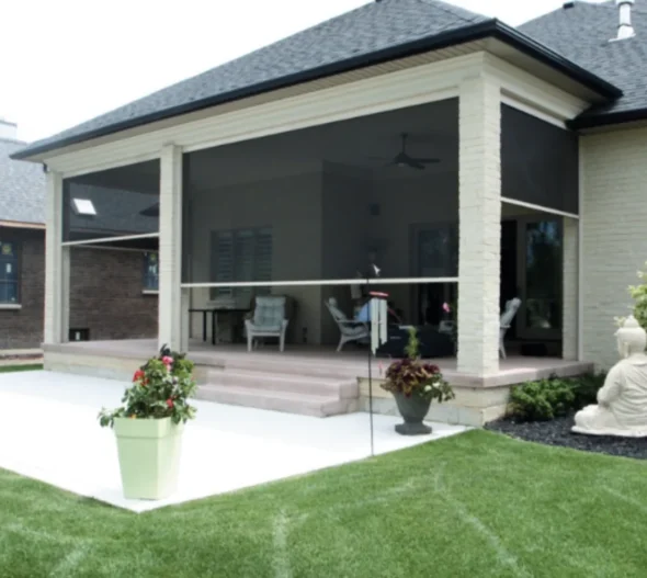 Dark vertical retractable screens lowered between porch columns beside outdoor seating