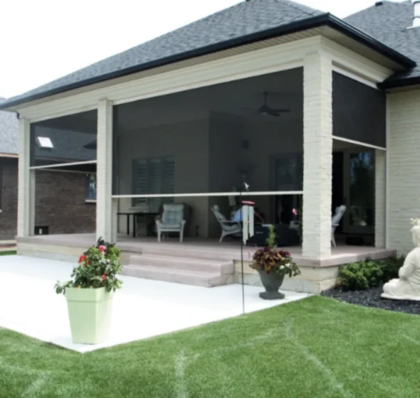 Dark vertical retractable screens lowered between porch columns beside outdoor seating