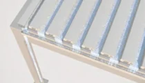 Close-up of louvered pergola roof with open louvres and water run-off channel