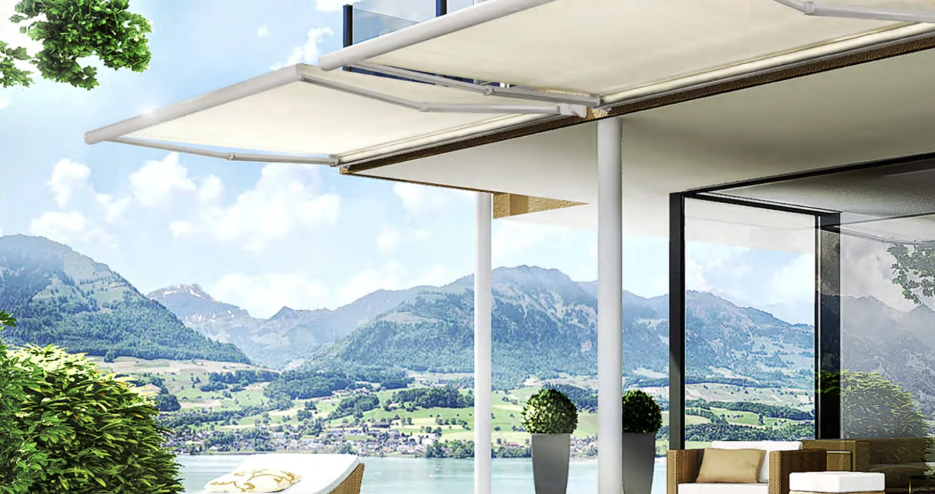 White retractable awnings extended over balcony overlooking lake and mountains