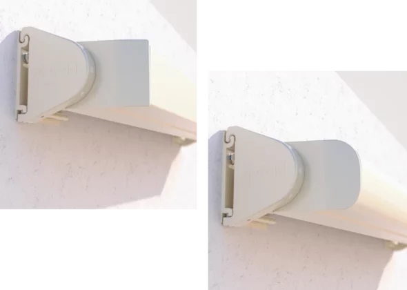 Close-up of open roller end bracket for retractable awning mounted on wall