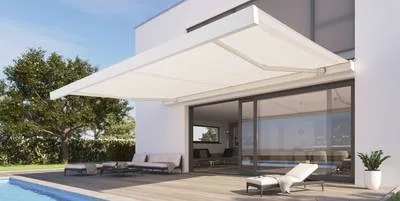 White retractable awning extended over patio lounge seating beside pool