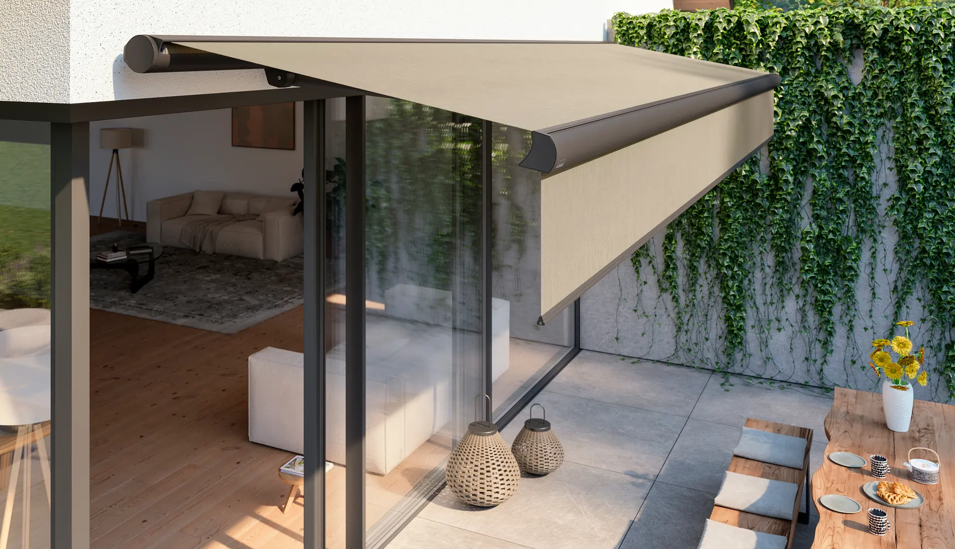 Beige retractable awning shading patio dining table beside ivy wall