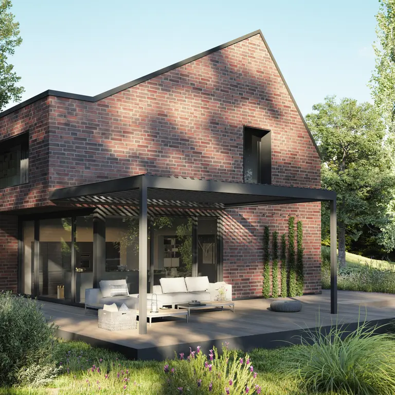 Wall-mounted louvered pergola with open louvres shading brick house patio seating